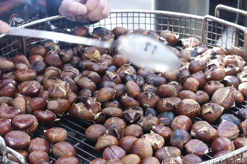 Roasted chestnuts in a metal roasting pan