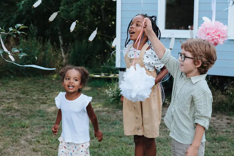 Children celebrating in a garden